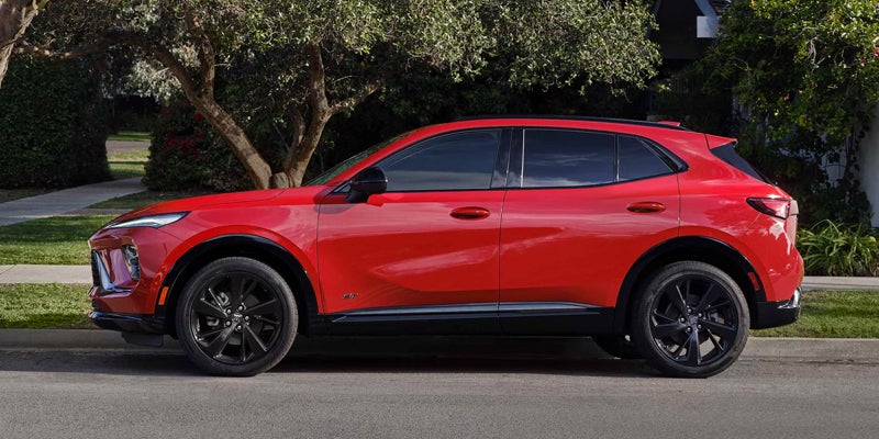 Rear view of a red Buick Envision parked on the street.